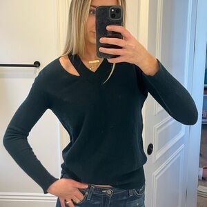 AUTUMN CASHMERE forest green sweater with shoulder and side cut-out detailing.